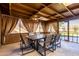 A covered patio with a table and chairs at 3428 W Vogel Ave, Phoenix, AZ 85051