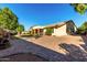 Spacious backyard with a brick patio and grassy area at 3479 E Esplanade Ct, Gilbert, AZ 85297