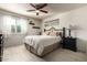 Bright bedroom with a queen-size bed and an ensuite bathroom at 3479 E Esplanade Ct, Gilbert, AZ 85297