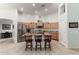 Modern kitchen with wood cabinets, granite countertops, and an island at 3479 E Esplanade Ct, Gilbert, AZ 85297