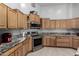 Modern kitchen featuring granite countertops and stainless steel appliances at 3479 E Esplanade Ct, Gilbert, AZ 85297