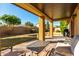 Relaxing covered patio with seating and a view of the backyard at 3479 E Esplanade Ct, Gilbert, AZ 85297