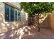 Small side yard with gravel, small tree, and gate at 3479 E Esplanade Ct, Gilbert, AZ 85297