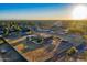 Aerial view showcasing the house, expansive yard, and distant city views at 3737 W Morrow Dr, Glendale, AZ 85308