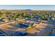 Aerial view of the property showing the house, expansive lot, and mountain views at 3737 W Morrow Dr, Glendale, AZ 85308