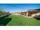 Expansive grassy backyard with a pool and patio area at 3737 W Morrow Dr, Glendale, AZ 85308