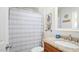 Clean bathroom with granite countertop and striped shower curtain at 3737 W Morrow Dr, Glendale, AZ 85308
