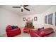 Cozy Gathering room with fireplace and red leather armchairs at 3737 W Morrow Dr, Glendale, AZ 85308