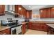 Modern kitchen with wood cabinets and granite counters at 3737 W Morrow Dr, Glendale, AZ 85308