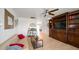 Bright living room features a comfy sofa and built-in shelving at 3737 W Morrow Dr, Glendale, AZ 85308