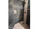 Spa-like shower with pebble tile and built-in bench at 3737 W Morrow Dr, Glendale, AZ 85308