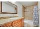 Clean bathroom with shower/tub combo and wood vanity at 4030 E Fairmount Ave, Phoenix, AZ 85018