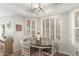 Cozy breakfast nook bathed in sunlight, featuring shutters and a modern light fixture at 4263 W Jasper Dr, Chandler, AZ 85226