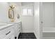 Stylish bathroom with double vanity and hexagon tile floor at 4712 E Palo Verde Dr, Phoenix, AZ 85018