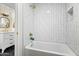 Clean bathroom with a modern bathtub and subway tile at 4712 E Palo Verde Dr, Phoenix, AZ 85018