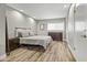 Modern bedroom with wood-look floors and stylish furnishings at 4712 E Palo Verde Dr, Phoenix, AZ 85018