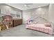 Adorable bedroom with a playful atmosphere and plenty of storage at 4712 E Palo Verde Dr, Phoenix, AZ 85018
