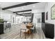 Open concept dining area with wood table and modern chairs, hardwood floors at 4712 E Palo Verde Dr, Phoenix, AZ 85018