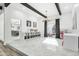 Bright dining room with kitchen view, built-in shelving, and large window at 4712 E Palo Verde Dr, Phoenix, AZ 85018