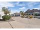 Single-story home with a gray garage door and manicured landscaping at 4712 E Palo Verde Dr, Phoenix, AZ 85018