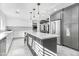 Renovated kitchen with gray cabinets, quartz countertops, and an island at 4712 E Palo Verde Dr, Phoenix, AZ 85018