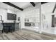 Modern kitchen with island and gray cabinets, open to living area at 4712 E Palo Verde Dr, Phoenix, AZ 85018