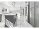 Modern kitchen with gray and white cabinets and a large island at 4712 E Palo Verde Dr, Phoenix, AZ 85018