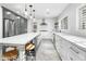 Spacious kitchen featuring a large island, stainless steel appliances, and white cabinets at 4712 E Palo Verde Dr, Phoenix, AZ 85018