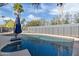 Inviting swimming pool with a blue tile finish and a gray wall at 4712 E Palo Verde Dr, Phoenix, AZ 85018