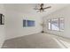 Spacious bedroom with neutral walls, carpet flooring, and ceiling fan at 4943 W Evans Dr, Glendale, AZ 85306