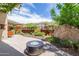 Landscaped backyard with fire pit and desert plants at 6525 E Cave Creek Rd # 20, Cave Creek, AZ 85331