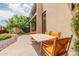 Relaxing patio furniture with a stone table and orange chairs at 6525 E Cave Creek Rd # 20, Cave Creek, AZ 85331