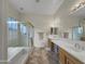 Bathroom boasts double sinks, a soaking tub and shower at 6623 W Robin Ln, Glendale, AZ 85310