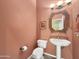 Powder room with pedestal sink, and updated fixtures at 6623 W Robin Ln, Glendale, AZ 85310