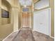 Bright and spacious entryway with tile flooring and wood door at 6623 W Robin Ln, Glendale, AZ 85310