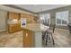 Kitchen island with granite countertop and breakfast bar seating at 6623 W Robin Ln, Glendale, AZ 85310