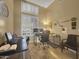 Home office with built-in shelving and plenty of natural light at 6623 W Robin Ln, Glendale, AZ 85310