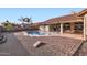 Backyard oasis with a kidney-shaped pool at 7147 W Voltaire Ave, Peoria, AZ 85381