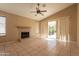 Open living area featuring a fireplace and sliding glass doors at 9071 E Rockwood Dr, Scottsdale, AZ 85255