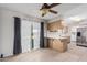 Bright kitchen features wood cabinets, stainless steel appliances, and tile flooring at 10407 W Desert Forest Cir, Sun City, AZ 85351