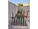 Landscaped garden with roses and white fence at 1042 W Morelos St, Chandler, AZ 85224