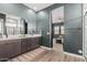 Double vanity bathroom with a view into the bedroom at 11054 E Utopia Ave, Mesa, AZ 85212