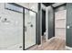 Bathroom with a large walk-in shower, marble tile, and modern fixtures at 11054 E Utopia Ave, Mesa, AZ 85212