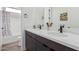 Modern bathroom with a double vanity and soaking tub at 11054 E Utopia Ave, Mesa, AZ 85212