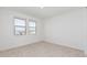 Simple bedroom with neutral walls and carpet at 11054 E Utopia Ave, Mesa, AZ 85212