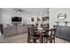 Dining area with a four-person table and view of the living room at 11054 E Utopia Ave, Mesa, AZ 85212