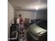 Garage with car, shelving, and storage items at 12103 W Rosewood Dr, El Mirage, AZ 85335