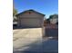 Attached garage with ample space for one vehicle and storage at 12103 W Rosewood Dr, El Mirage, AZ 85335