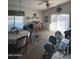 Bright living room with dining area and large window at 12103 W Rosewood Dr, El Mirage, AZ 85335