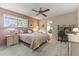 Comfortable bedroom with ensuite bath and home office area at 13416 N Cedar Dr, Sun City, AZ 85351